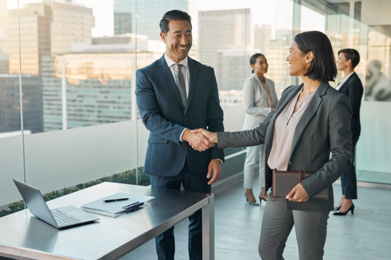 investment banking deal handshake corporate skyline