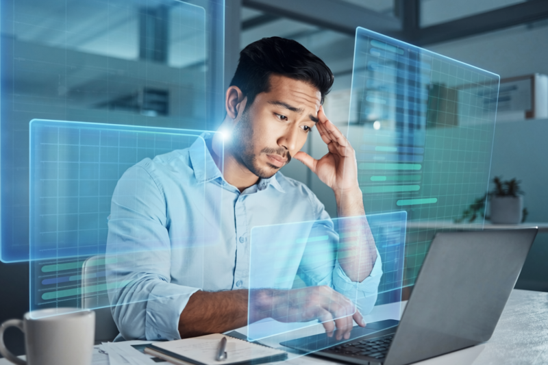 office worker overwhelmed AI hologram screens stress