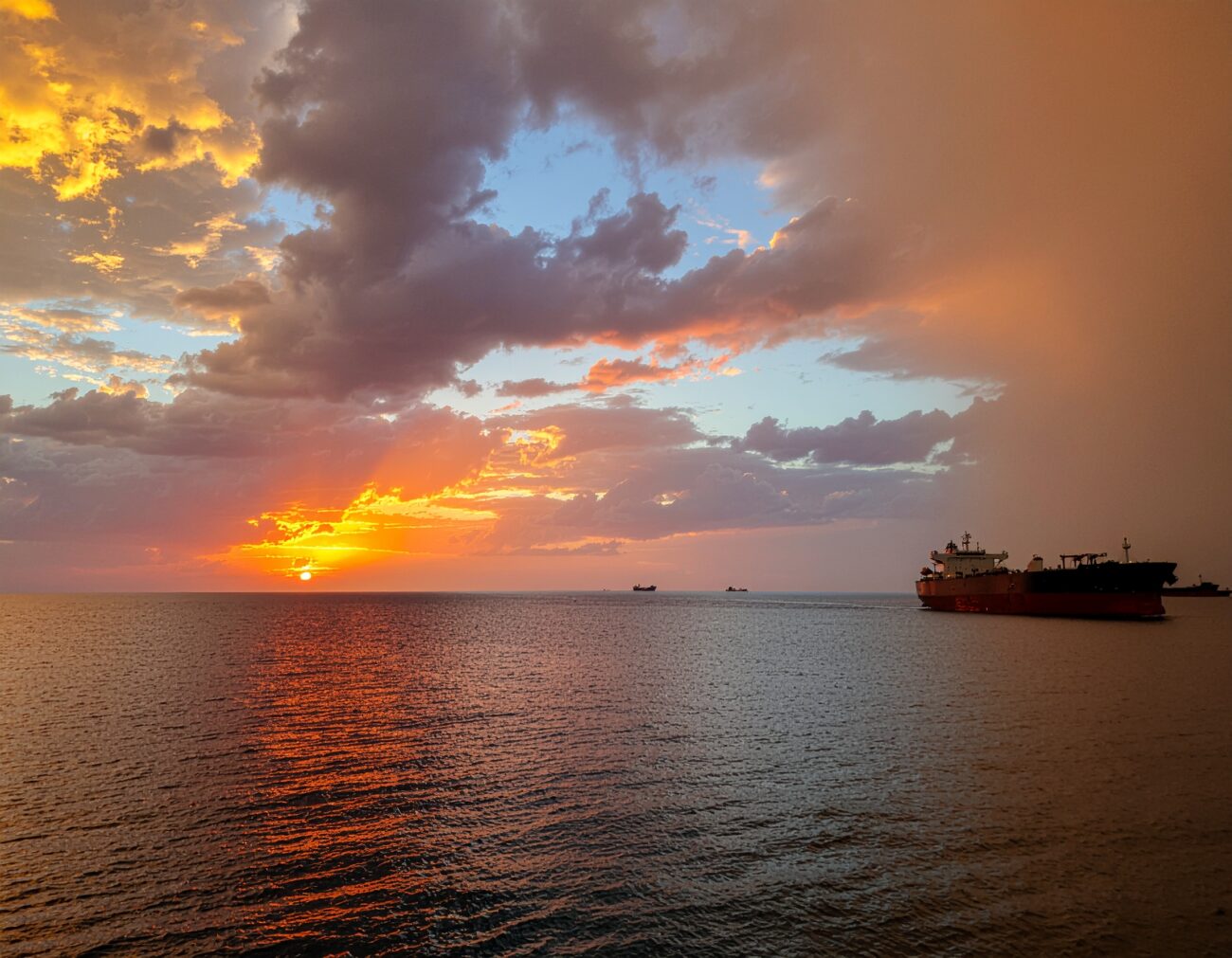 oil tanker strait of hormuz sunset dramatic