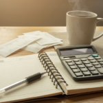 personal finance planning desk notebook calculator